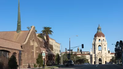 View of street in Pasadena, California with church at left and city hall in background