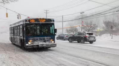 CTtransit bus driving through snowy street in Norwalk, Connecticut