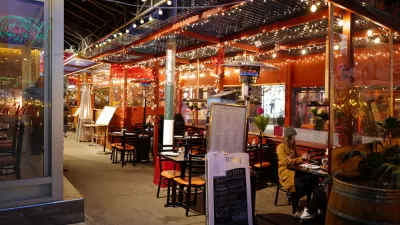 Italian restaurant outdoor dining patio with string lights in New York City