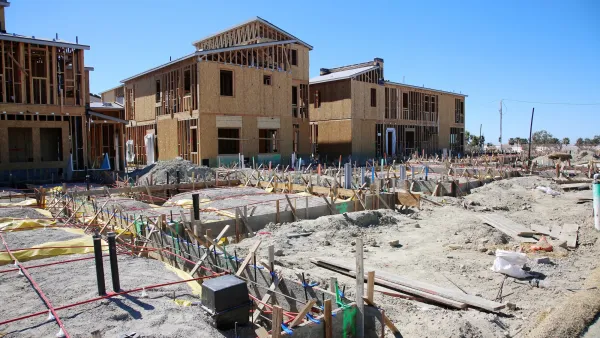 Wood frame multifamily housing under construction.