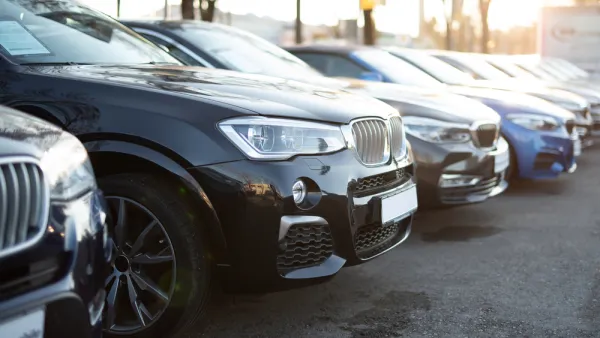 Row of cars in parking lot