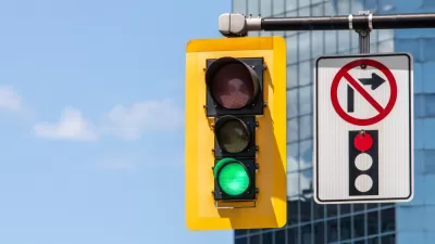 Stoplight with green light and "no right turn on red" pictograph on overhead signal