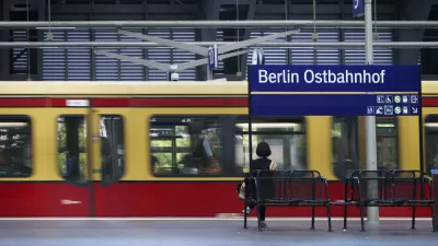 A platform of the Berlin East Railway station with a waiting traveler and a tram on June 17, 2014 in Berlin