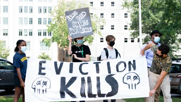 SAINT LOUIS, MO. - August 2, 2021: Protestors hold a banner that reads "Eviction Kills" at an "End Eviction" protest opposing the end of the federal eviction moratorium.