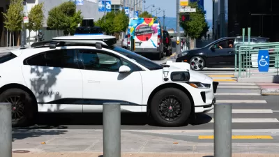 White Waymo self-driving car on San Francisco street