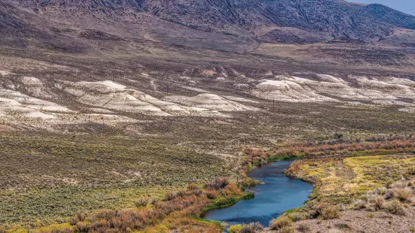 An aerial view of Truckee River, surrounded by mountains.