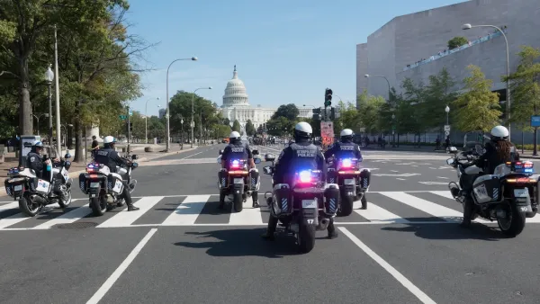 Several Washington DC police on motorcycles with capitol dome in background.