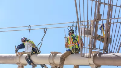 Worker performing maintenance work on the Brooklyn Bridge, New York City