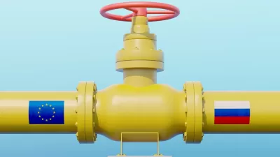 Yellow gas pipeline with E.U. flag on one side and Russia flag on the other side