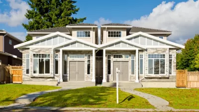 Duplex with twin two-story homes