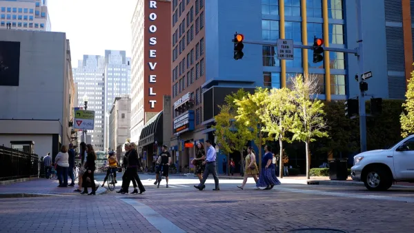 People cross the street in downtown Pittsburg. 