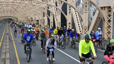People biking across the Queensboro Bridge