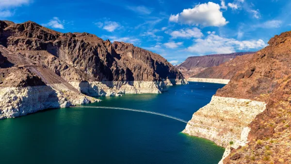 Colorado River at Lake Mead with low water line visible on rocks.