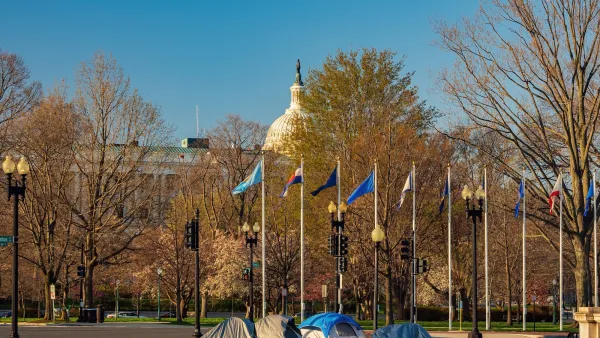 Tents used by homeless people in Washington, D.C. with Capitol dome in background.