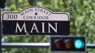 Main Street Sign with Traffic Light in the Background in Downtown Houston, Texas
