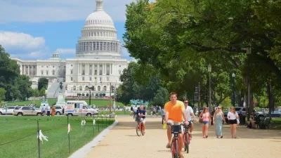 People on bikes in front of the U.S. Capitol in Washington, D.C.