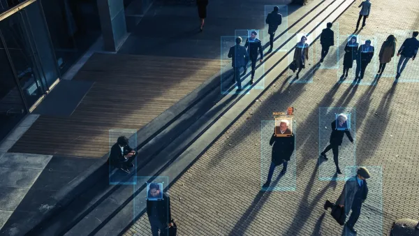 Image from CCTV camera with boxes around peope identifying human shapes.