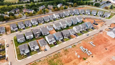 Aerial view of dense single-family homes in neighborhood still under construction