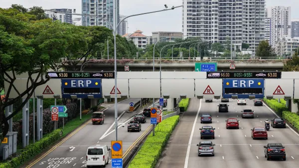 Multilane roadway in Singapore with congestion pricing gate.