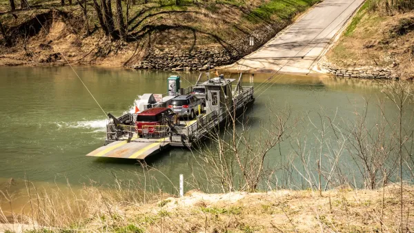 Small ferry carrying two cars across small river in Mammoth Cave National Park, Kentucky.