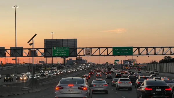 Rush hour traffic on freeway in Houston, Texas at sunset.