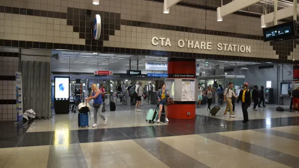 Chicago O'Hare transit station with people walking.