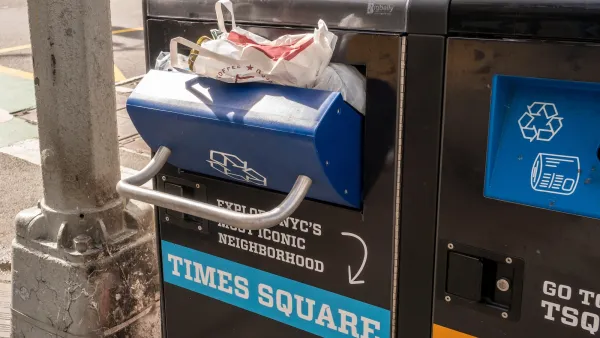 Close-up on overflowing trash can in New York City labeled with Times Square.