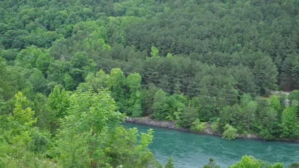 The Arkansas River surrounded by cedar trees.