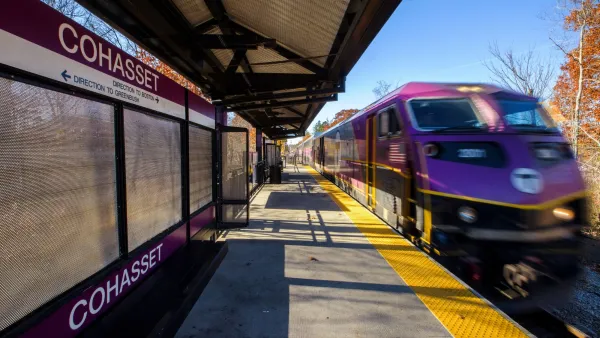 Purple MBTA train at station in Cohasset Station, Massachusetts.