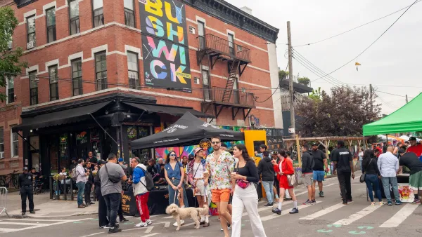 People walking around at a street fair in Bushwick, New York City.