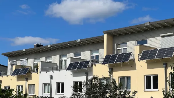 Solar panels installed on balconies on multi-family building.
