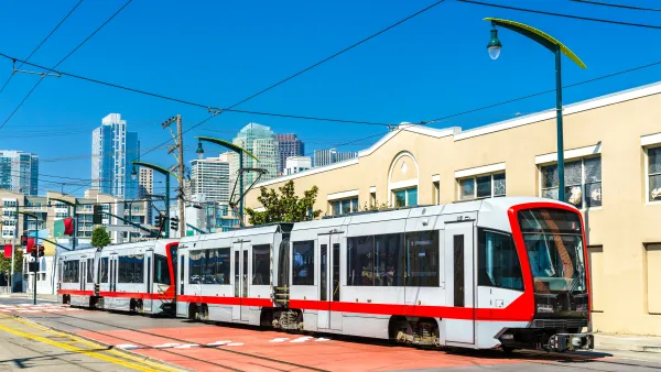 A San Francisco tram in front of tall buildings