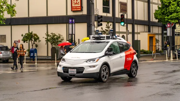 White and red Cruise autonomous car in San Francisco, California.