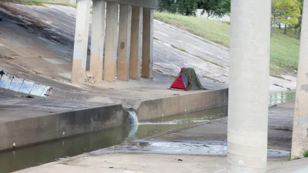 Tent pitched under freeway overpass in Houston, Texas.