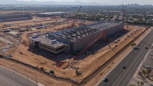 Aerial of large data center under construction in Phoenix surrounded by characteristic red soil.