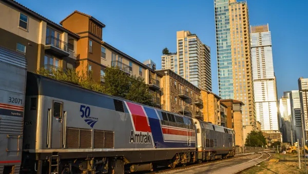 Amtrak train with Austin high-rises in the background.