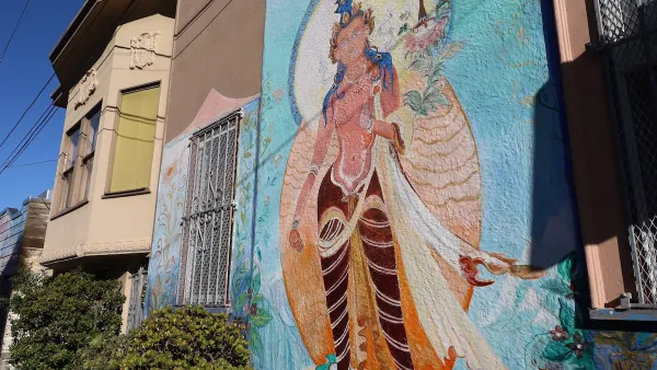 Mural of Asian deity on building in San Francisco.