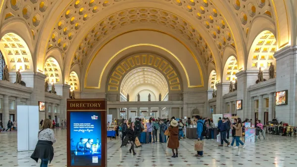 Main hall with arched ceiling and alcoves filled with people in Union Station, Washington DC.