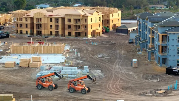 Three-story wood-framed apartment buildings being built in North Port, Florida.