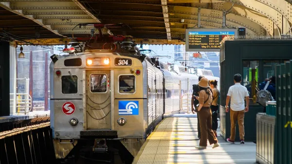 Silver train at outdoor covered platform in Philadelphia, Pennsylvania.