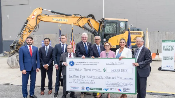 Elected officials pose after conclusion of celebration for full funding for Hudson Tunnel Project at construction site in New York on July 8, 2024.