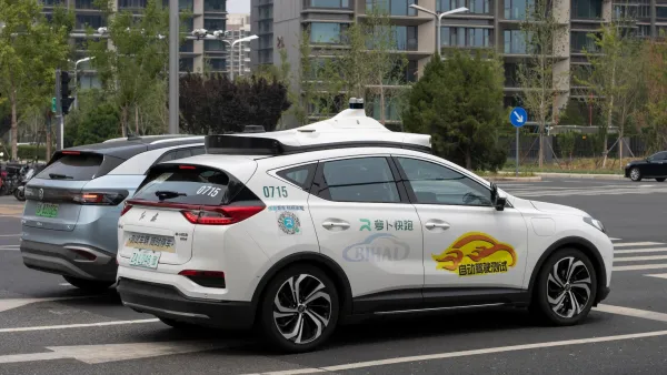 White Baidu self-driving car on street in China.