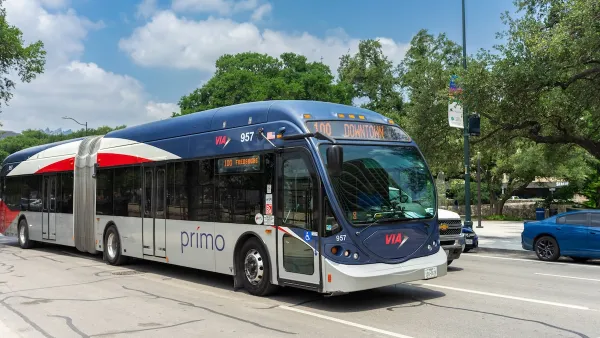 A texas bus drives down a multi lane road