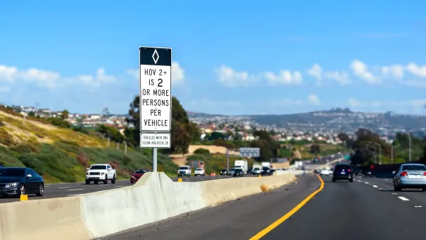 Sign for HOV lane for carpools 2+ on California freeway.