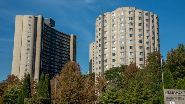 Round modernist concrete public housing towers with arched windows in Chicago, Illinois.