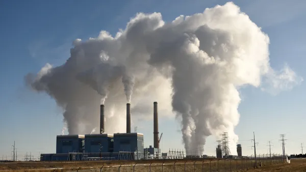 Smoke billows out of a power plant.