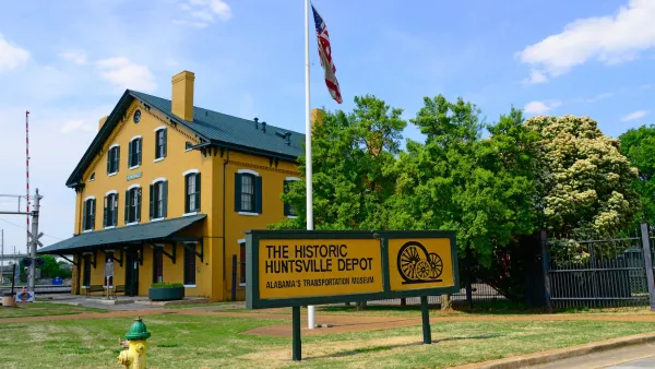 Yellow wooden building housing historic train depot in Huntsville, Alabama.