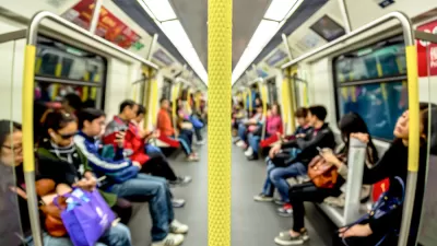 Blurry view of semi-crowded subway car