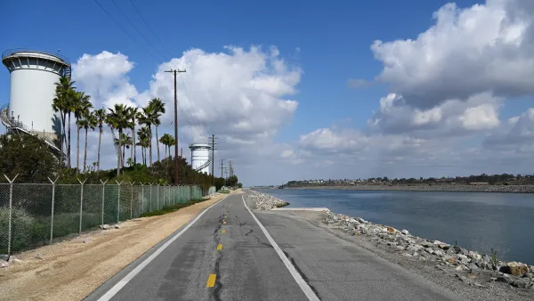 The Santa Ana River Trail, a paved road with a body of water to the right.