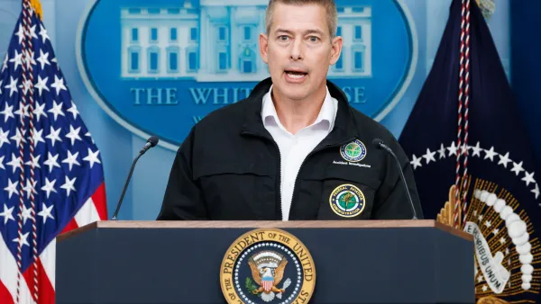 U.S. Transportation Secretary Sean Duffy speaking at a podium in front of American flag and White House logo on blue background.